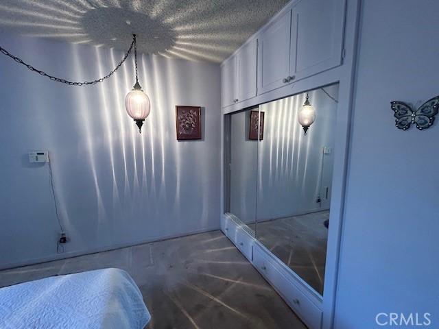 1220 W L St, Wilmington, CA 90744 - interior space featuring concrete flooring and a textured ceiling