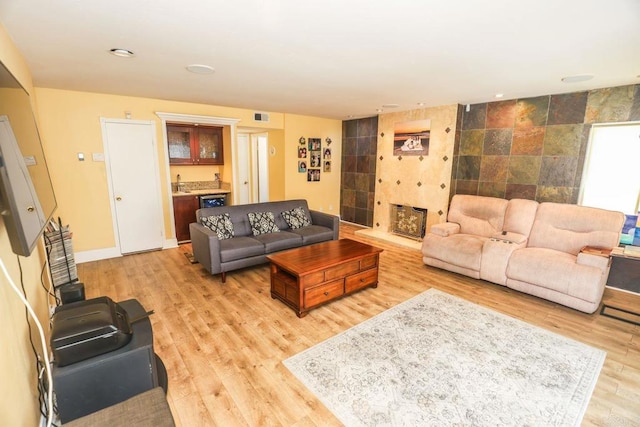 1560 Cavernt Pt, Chula Vista, CA 91911 - living room with light wood-style flooring, bar, and recessed lighting