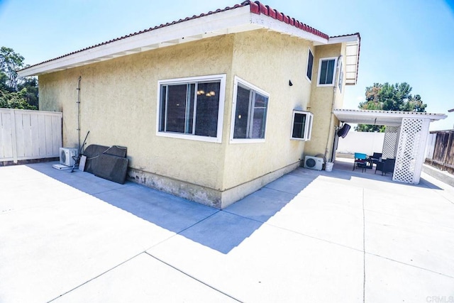 1560 Cavernt Pt, Chula Vista, CA 91911 - view of home's exterior featuring a patio, stucco siding, and a tile roof