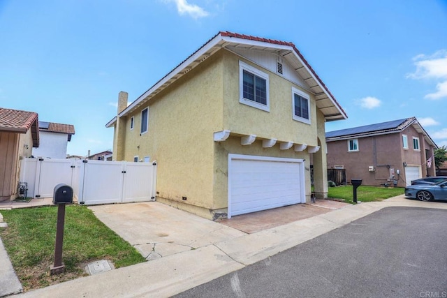 1560 Cavernt Pt, Chula Vista, CA 91911 - view of side of property featuring a gate, stucco siding, driveway, and an attached garage