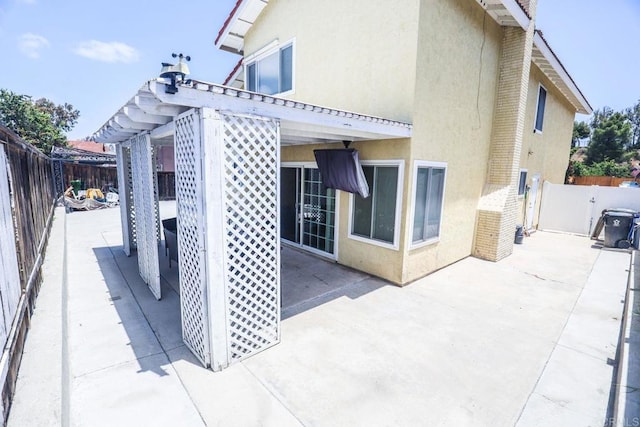 1560 Cavernt Pt, Chula Vista, CA 91911 - rear view of property featuring stucco siding, a patio area, and a fenced backyard