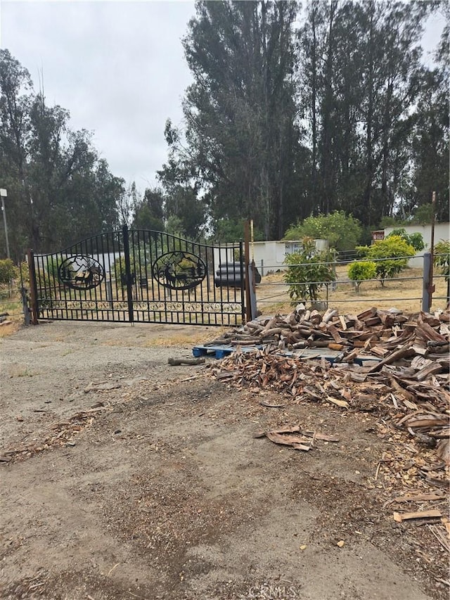 462 Camino Perillo, Arroyo Grande, CA 93420 - view of yard with a gate and view of scattered trees