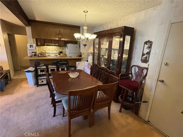 550 W Regent St Unit 338, Inglewood, CA 90301 - dining area with a chandelier, light carpet, and a textured ceiling