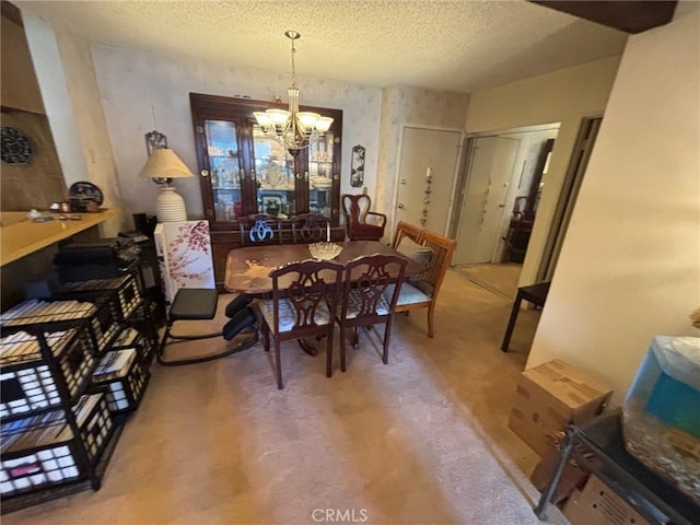 550 W Regent St Unit 338, Inglewood, CA 90301 - dining room featuring a chandelier and a textured ceiling