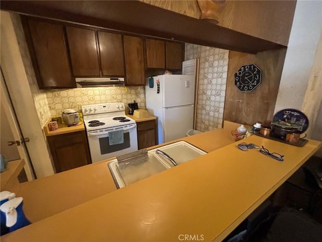550 W Regent St Unit 338, Inglewood, CA 90301 - kitchen featuring white appliances, extractor fan, tasteful backsplash, and light countertops