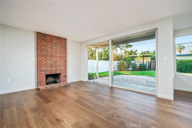 817 W Hollyvale St, Glendora, CA 91740 - unfurnished living room with wood finished floors and a fireplace