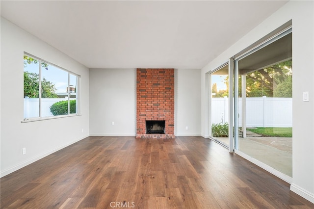 817 W Hollyvale St, Glendora, CA 91740 - unfurnished living room with dark wood-type flooring and a fireplace