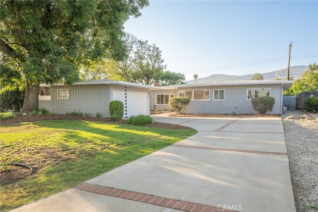 817 W Hollyvale St, Glendora, CA 91740 - ranch-style house with driveway, a front yard, and a garage