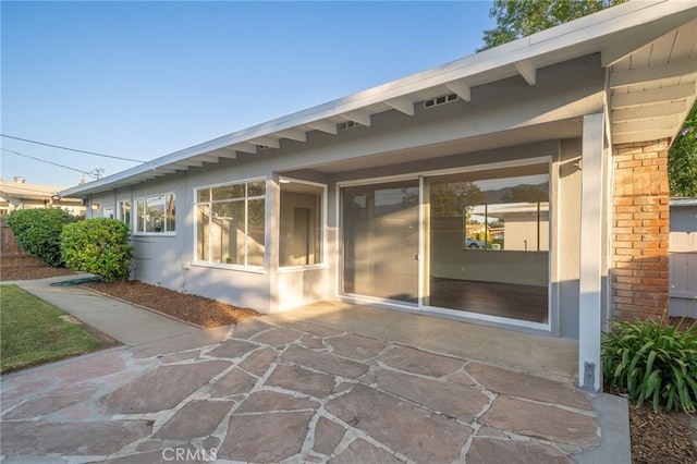 817 W Hollyvale St, Glendora, CA 91740 - rear view of property featuring a patio, brick siding, and stucco siding