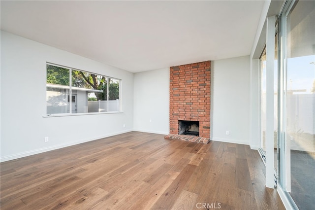 817 W Hollyvale St, Glendora, CA 91740 - unfurnished living room with wood finished floors and a fireplace