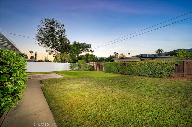 817 W Hollyvale St, Glendora, CA 91740 - yard at dusk with a fenced backyard
