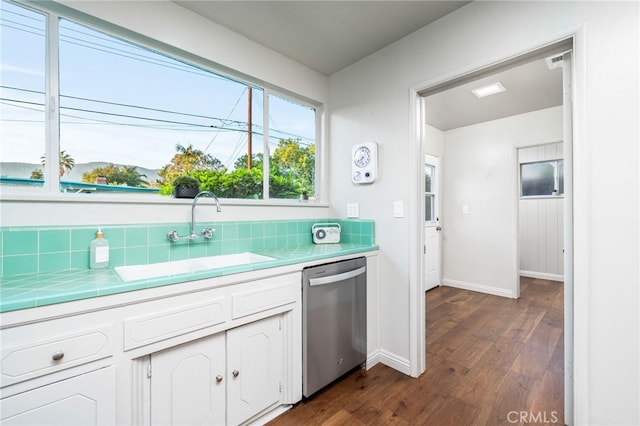 817 W Hollyvale St, Glendora, CA 91740 - kitchen with stainless steel dishwasher, tile countertops, dark wood finished floors, white cabinets, and decorative backsplash