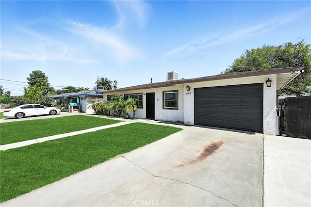 16874 Athol St, Fontana, CA 92335 - ranch-style house with an attached garage, concrete driveway, stucco siding, and a front lawn