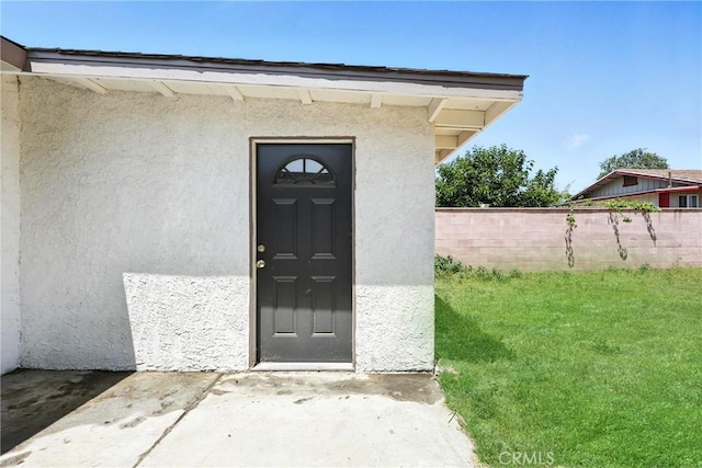 16874 Athol St, Fontana, CA 92335 - doorway to property featuring stucco siding