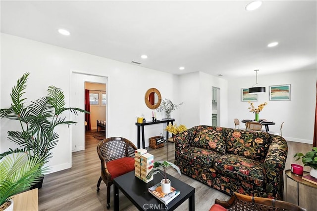 16874 Athol St, Fontana, CA 92335 - living room featuring recessed lighting and wood finished floors