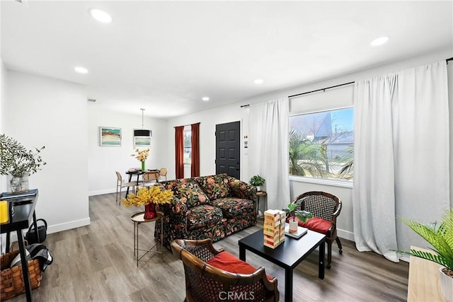 16874 Athol St, Fontana, CA 92335 - living room with healthy amount of natural light, wood finished floors, and recessed lighting