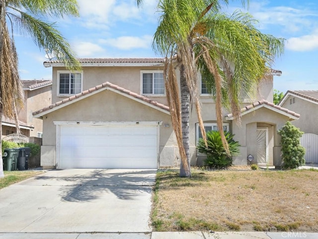 15372 Brandon Ln, Fontana, CA 92337 - view of front of home featuring stucco siding, driveway, a tiled roof, and a garage