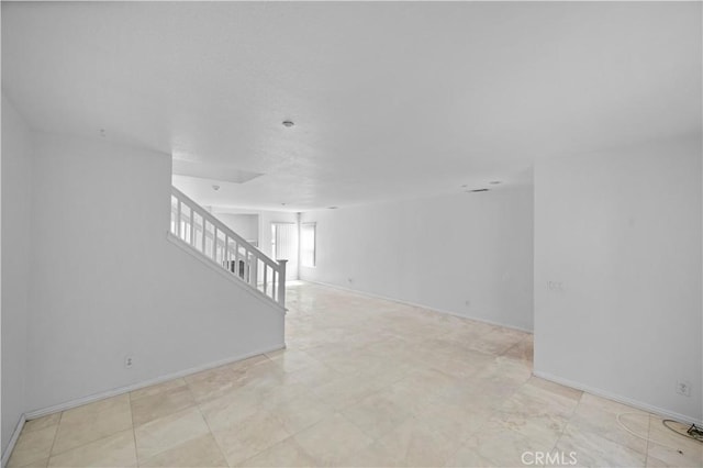 15372 Brandon Ln, Fontana, CA 92337 - empty room with stairway and baseboards