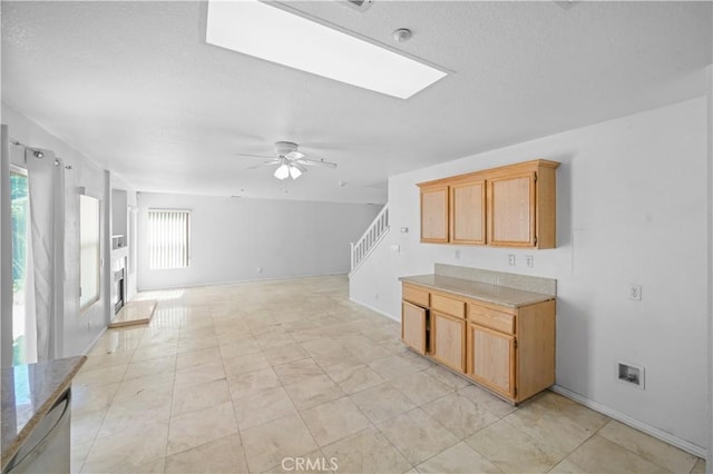 15372 Brandon Ln, Fontana, CA 92337 - kitchen featuring plenty of natural light, ceiling fan, light countertops, and open floor plan