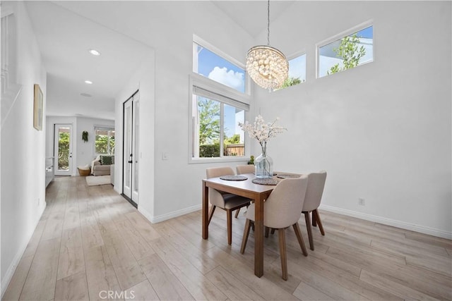 21 Dawnwood, Ladera Ranch, CA 92694 - dining area featuring a chandelier, light wood-type flooring, recessed lighting, and a high ceiling