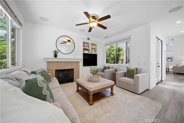 21 Dawnwood, Ladera Ranch, CA 92694 - living room with ceiling fan, built in features, wood finished floors, a fireplace, and recessed lighting