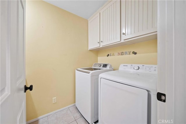 21 Dawnwood, Ladera Ranch, CA 92694 - laundry room featuring washing machine and dryer, light tile patterned flooring, and cabinet space