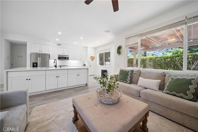 21 Dawnwood, Ladera Ranch, CA 92694 - living room featuring light wood-type flooring, a ceiling fan, and recessed lighting