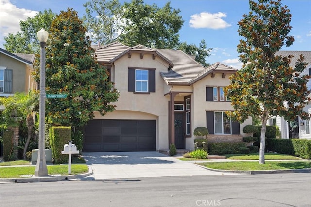 21 Dawnwood, Ladera Ranch, CA 92694 - traditional home with driveway, an attached garage, a tile roof, and stucco siding