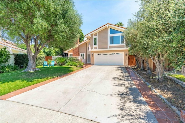 24046 Lindley St, Mission Viejo, CA 92691 - view of front of home featuring an attached garage, driveway, and stucco siding