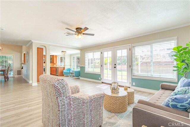 24046 Lindley St, Mission Viejo, CA 92691 - living area featuring light wood-style floors, a ceiling fan, french doors, and ornamental molding