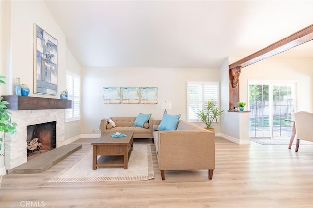 24046 Lindley St, Mission Viejo, CA 92691 - living area with wood finished floors, a fireplace, and vaulted ceiling