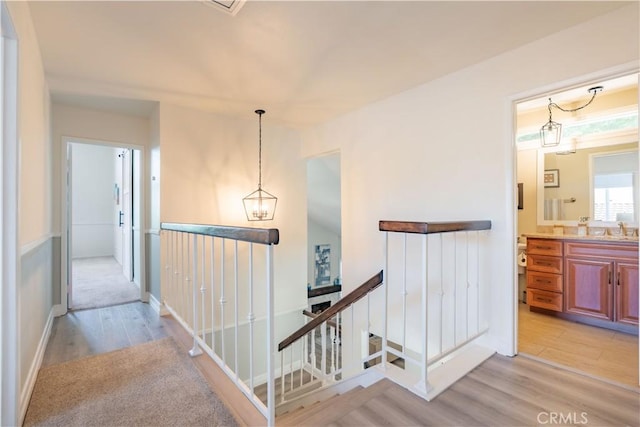 24046 Lindley St, Mission Viejo, CA 92691 - corridor with an upstairs landing and light wood-style flooring
