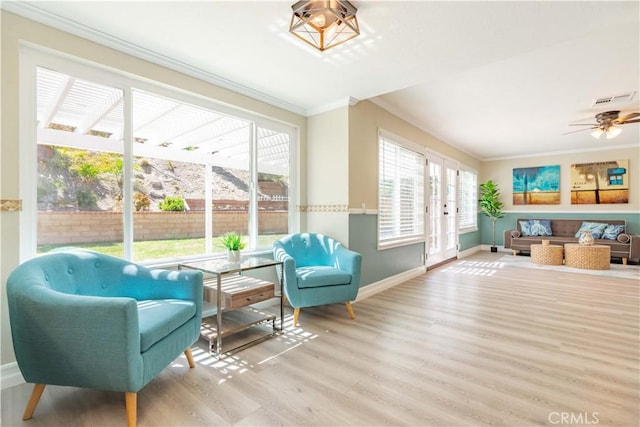 24046 Lindley St, Mission Viejo, CA 92691 - living area featuring ornamental molding, wood finished floors, and a ceiling fan
