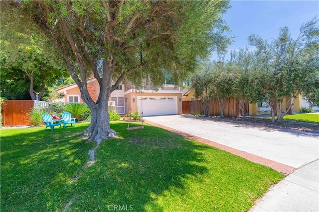 24046 Lindley St, Mission Viejo, CA 92691 - view of property hidden behind natural elements with driveway, stucco siding, and an attached garage