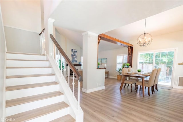 24046 Lindley St, Mission Viejo, CA 92691 - dining room featuring stairway, light wood-style flooring, and a chandelier