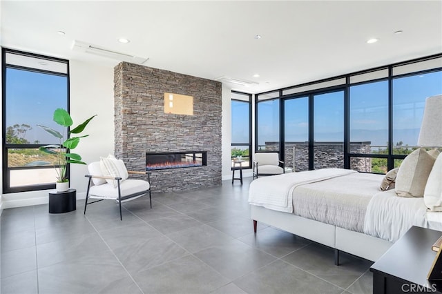1912 Edgefair Ln, Redlands, CA 92373 - tiled bedroom with expansive windows and a stone fireplace