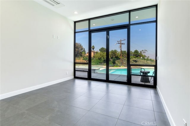 1912 Edgefair Ln, Redlands, CA 92373 - tiled empty room with baseboards and floor to ceiling windows