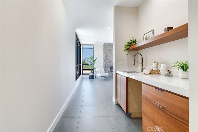1912 Edgefair Ln, Redlands, CA 92373 - hallway with tile patterned flooring, floor to ceiling windows, and recessed lighting
