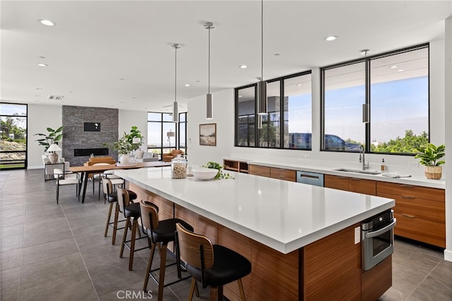 1912 Edgefair Ln, Redlands, CA 92373 - kitchen featuring modern cabinets, brown cabinetry, stainless steel appliances, a large island, and recessed lighting