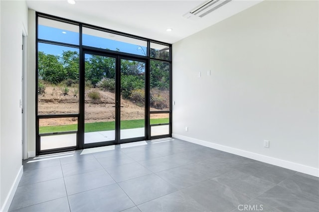 1912 Edgefair Ln, Redlands, CA 92373 - spare room featuring a wall of windows and tile patterned floors
