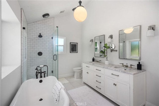 24532 La Cienega St, Laguna Hills, CA 92653 - bathroom featuring a freestanding tub, vaulted ceiling, a shower stall, and double vanity