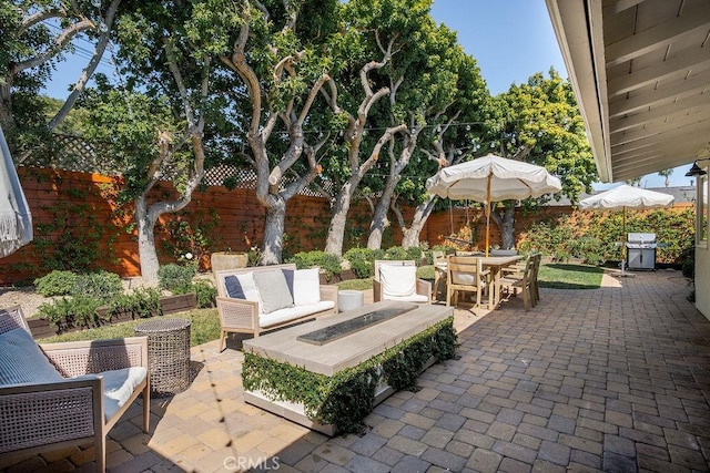 484 E 16th St, Costa Mesa, CA 92627 - fenced backyard with a patio, an outdoor living space, grilling area, and outdoor dining area