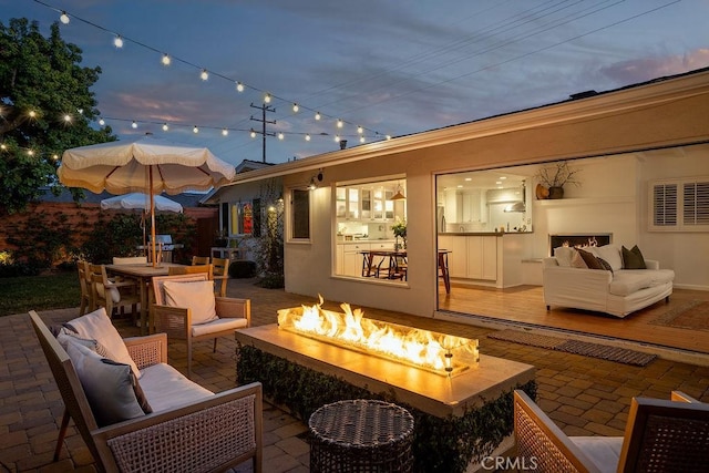 484 E 16th St, Costa Mesa, CA 92627 - view of patio featuring an outdoor living space with a fire pit and outdoor dining area