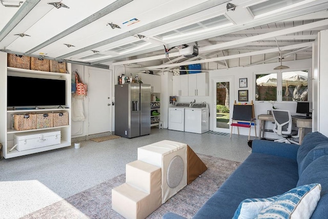 484 E 16th St, Costa Mesa, CA 92627 - living room with washer and dryer, dark aggregate flooring, a garage, and lofted ceiling