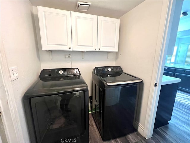 14016 Las Entradas, Bakersfield, CA 93314 - laundry room featuring washing machine and clothes dryer, cabinet space, and dark wood-style floors