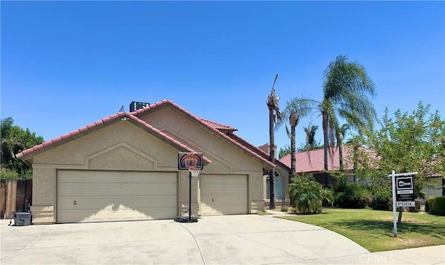 14016 Las Entradas, Bakersfield, CA 93314 - view of front of property with a garage, driveway, a tile roof, and stucco siding