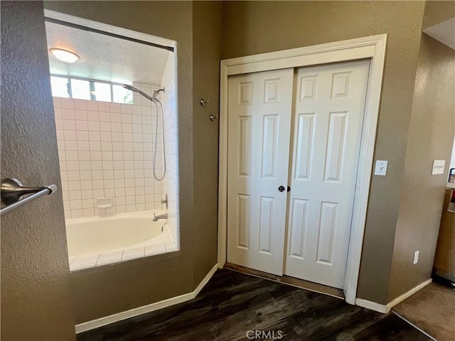 14016 Las Entradas, Bakersfield, CA 93314 - bathroom with wood finished floors and bathing tub / shower combination