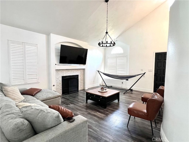 14016 Las Entradas, Bakersfield, CA 93314 - living room with dark wood-style flooring, a fireplace, and high vaulted ceiling