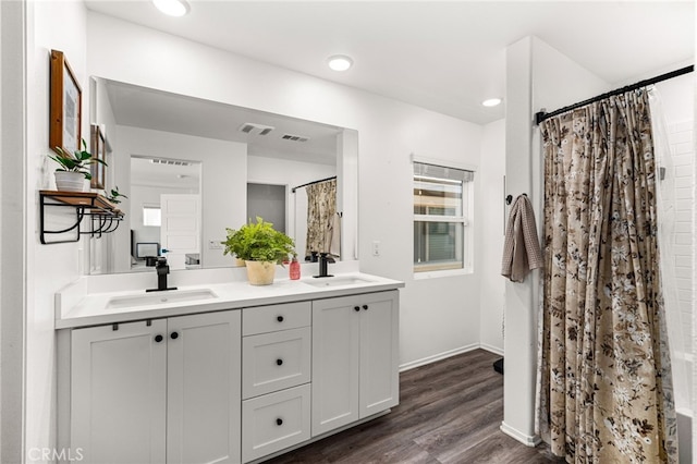 872 Bluebell Way, Beaumont, CA 92223 - bathroom with double vanity, wood finished floors, curtained shower, and recessed lighting