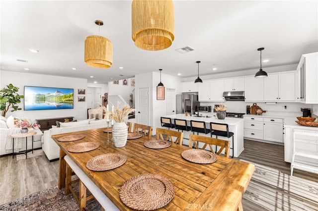 872 Bluebell Way, Beaumont, CA 92223 - dining area with wood finished floors and recessed lighting